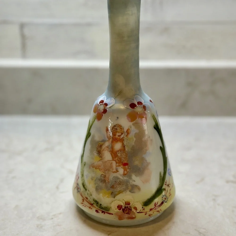 ANTIQUE BARBER SHOP BOTTLE WITH ATTRACTIVE CHERUB PICTURED ON FRONT SIDE.